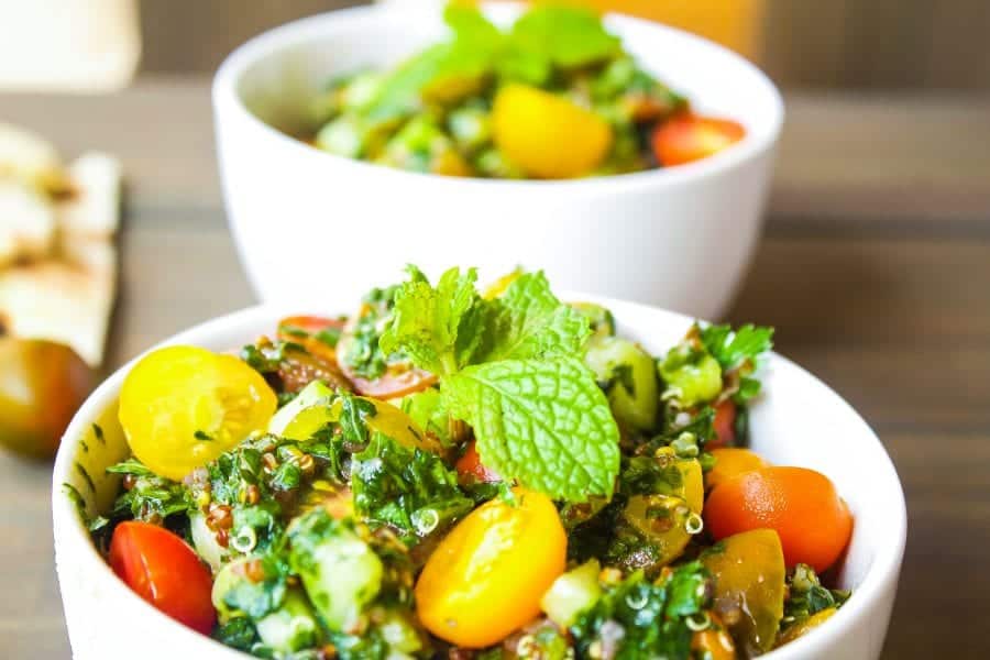 quinoa Tabbouleh salad in a bowl with mint leaves