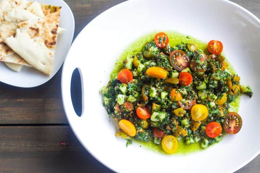 quinoa Tabbouleh salad in a bowl with pita bread