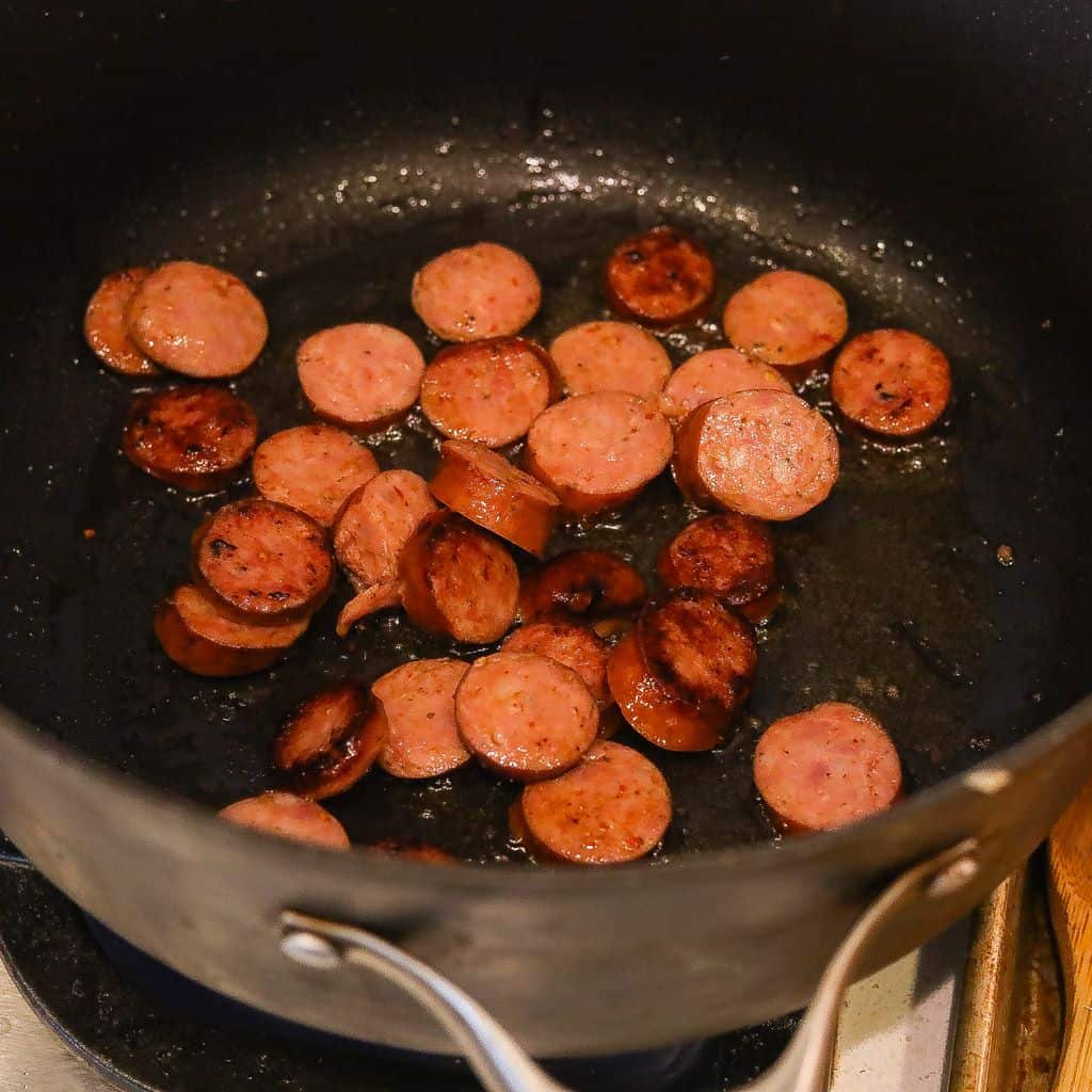 sausage cooking in pan