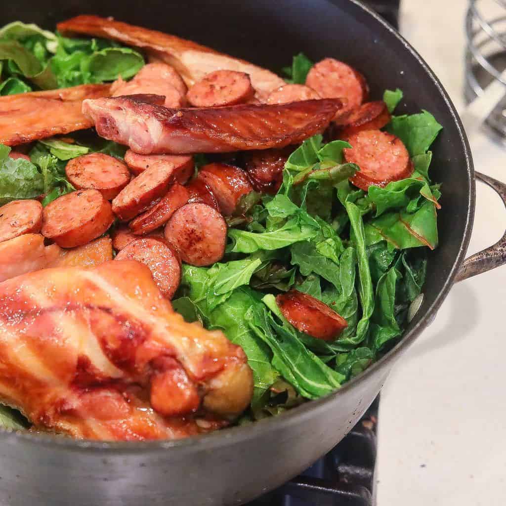 gumbo ingredients cooking in a pot