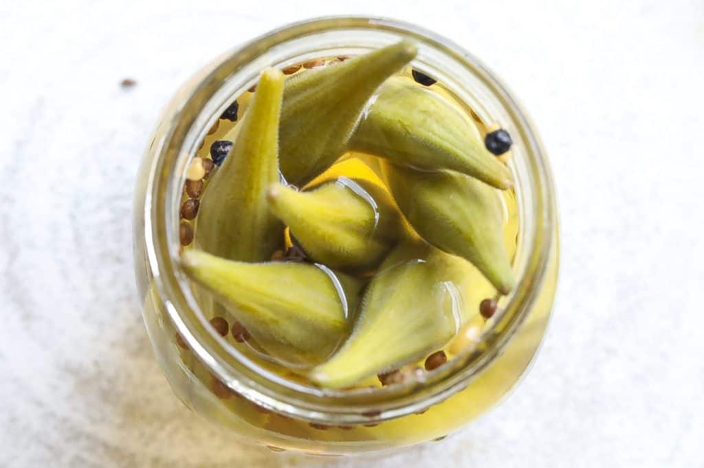 pickled okra in a glass jar