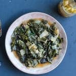 wine braised collard greens on a plate