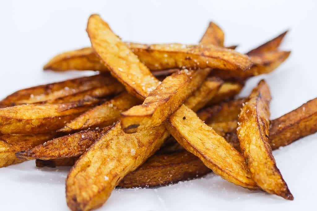 Belgian fries on a white platter