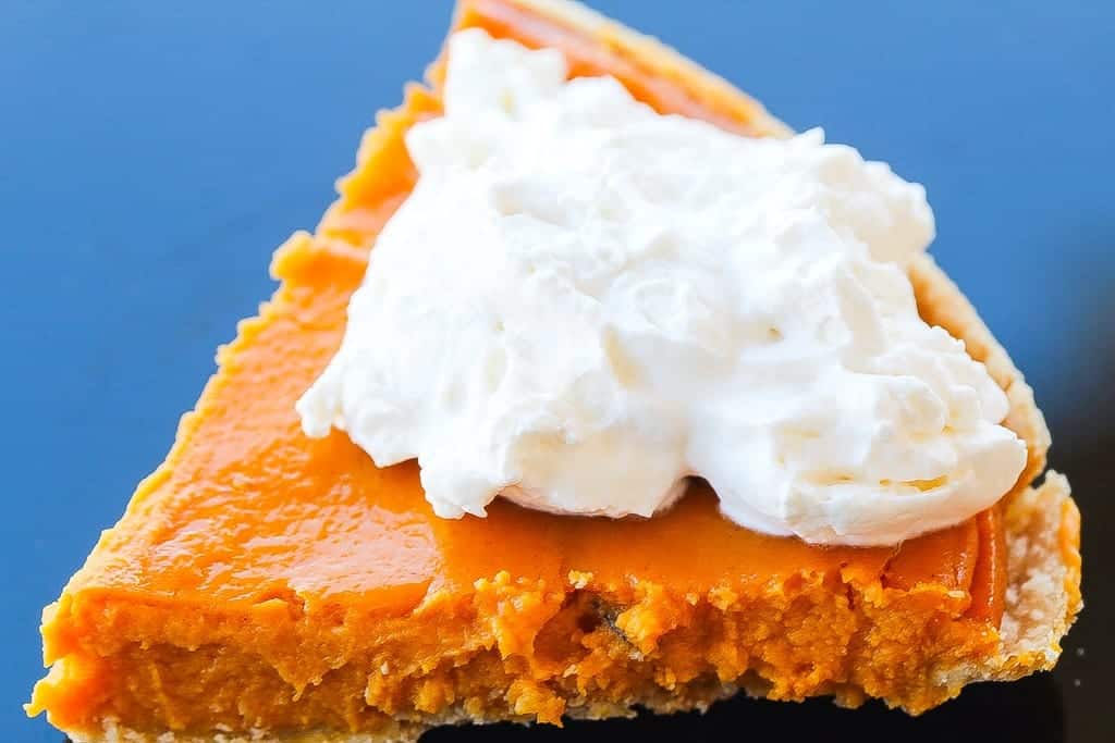 Southern sweet potato pie with cream on a plate