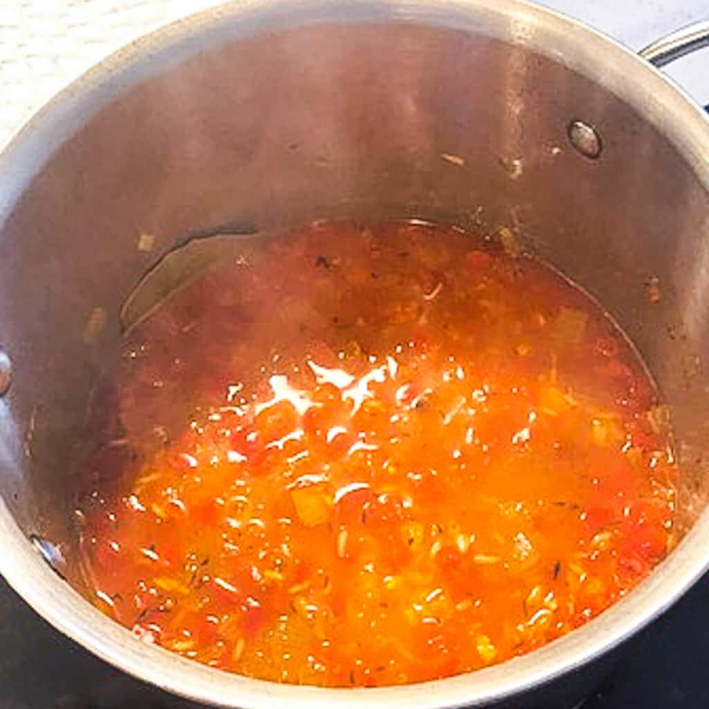 jollof rice cooking in a pot