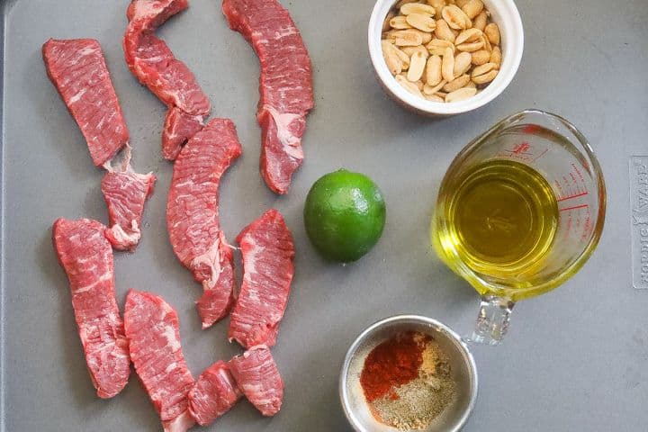 beef suya ingredients on a tray