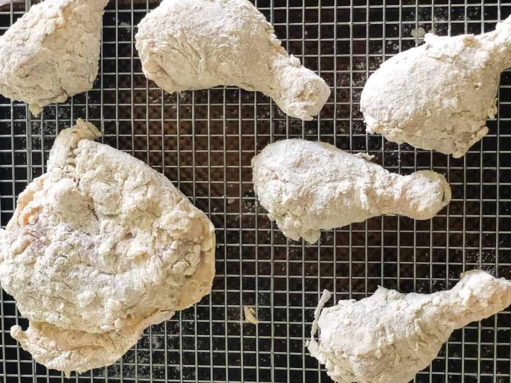 chicken with flour on a tray
