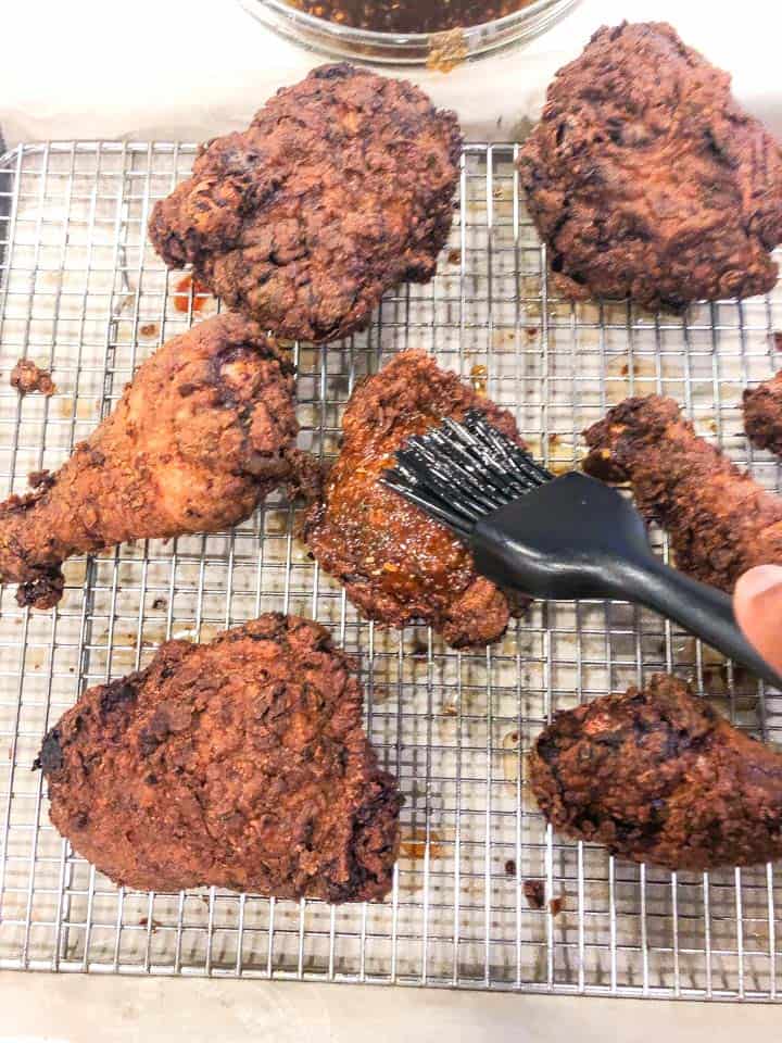 brushing glaze on fried chicken