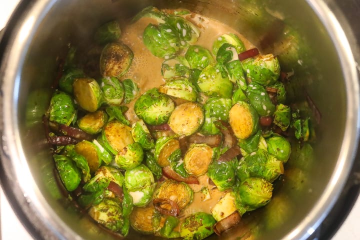 brussel sprouts braising in coconut milk