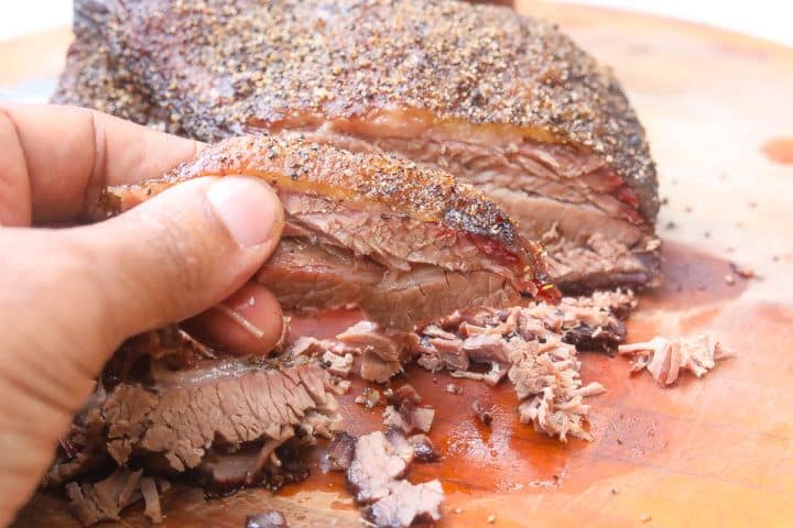 smoked brisket on a cutting board