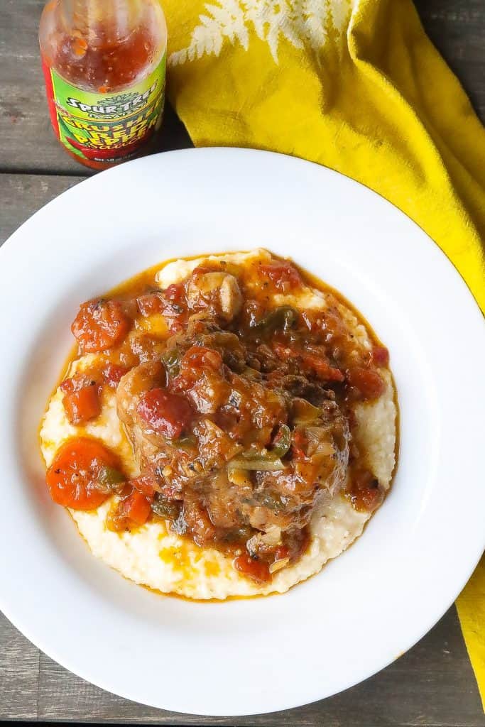 oxtails with grits in a bowl