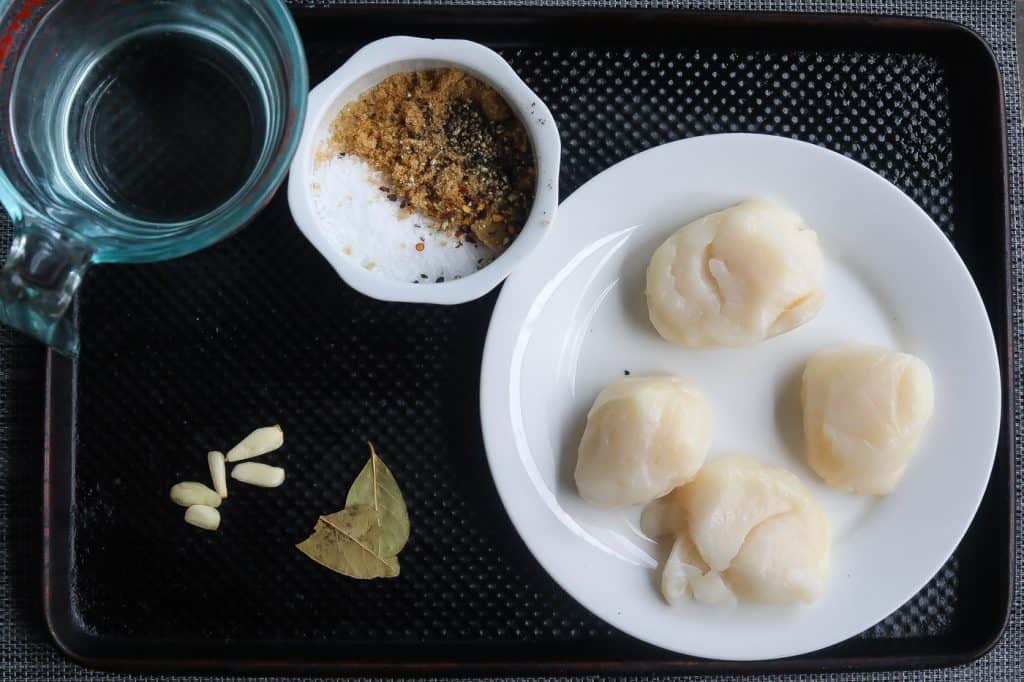 scallops and brine ingredinets on tray