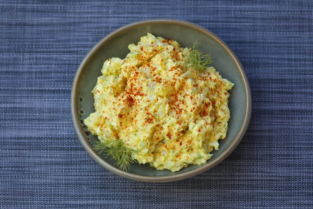 potato salad in green bowl