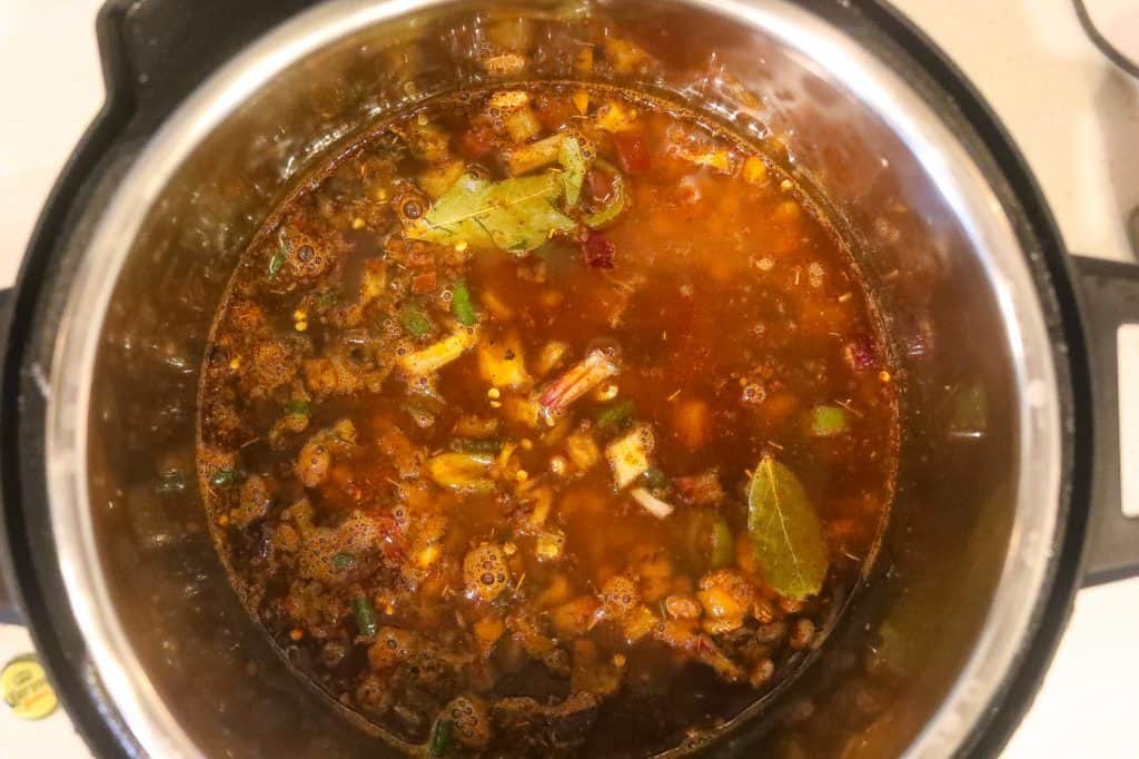 beans and peppers cooking in a pot