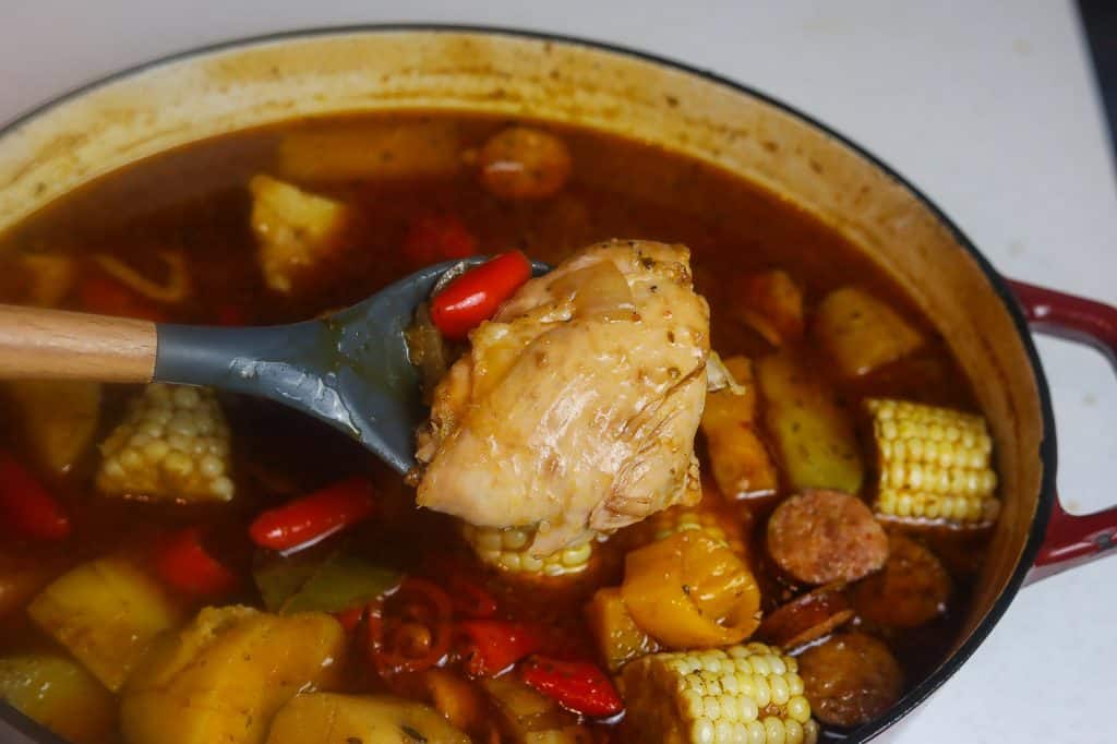 stew cooking in red pot