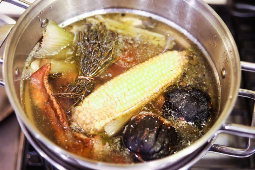 stock ingredients in pot of water