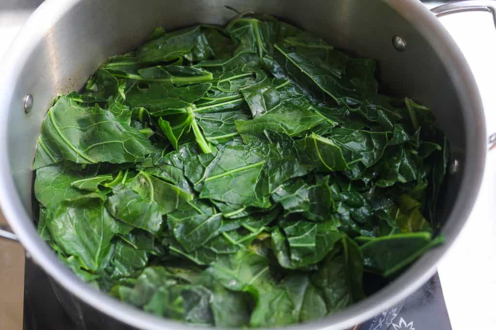 collard greens cooking in a pot