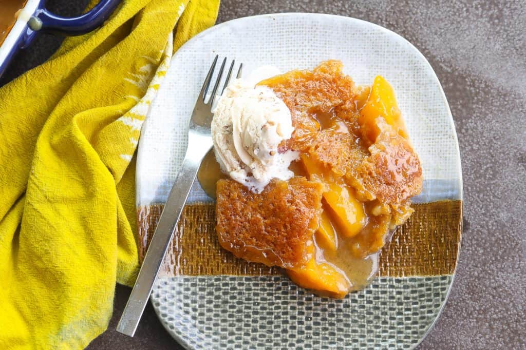 peach cobbler on a tri-color plate