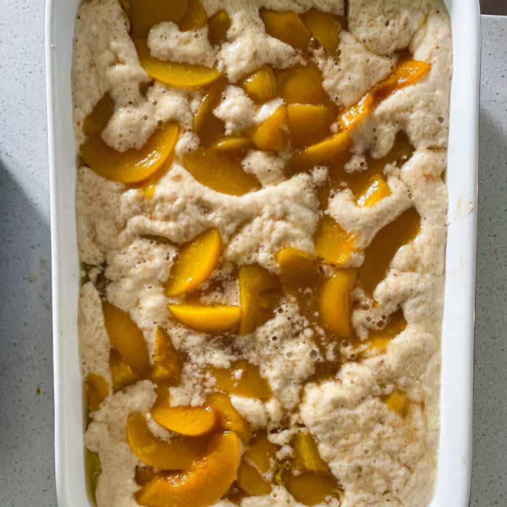 peach cobbler mix in whit pan