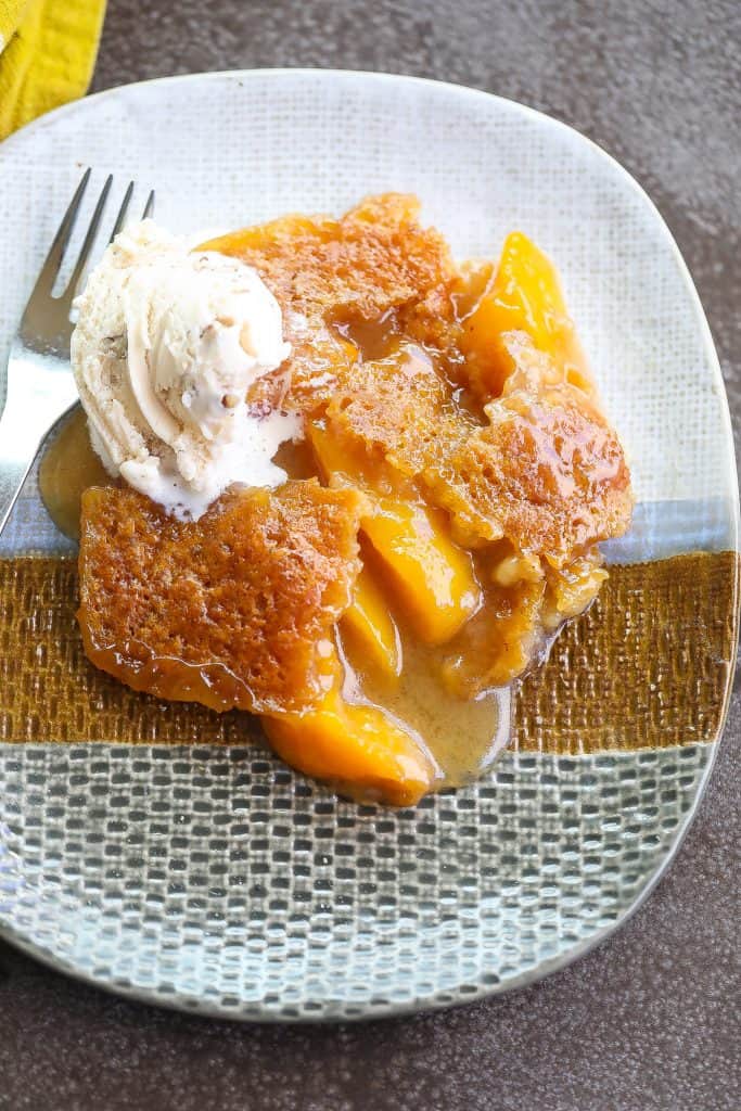 peach cobbler on a tri-color plate