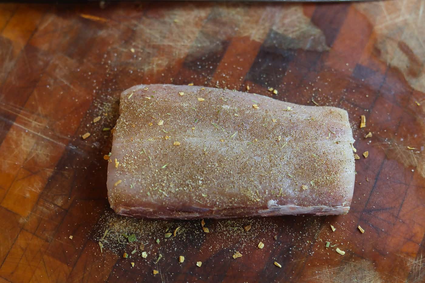 mahi mahi with jerk spice on a cutting board