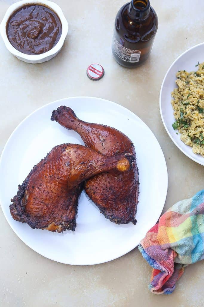 jerk chicken legs on a white plate