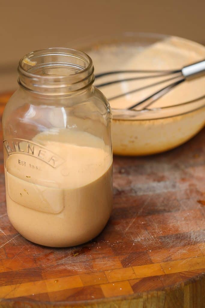 peach colored sauce in a jar