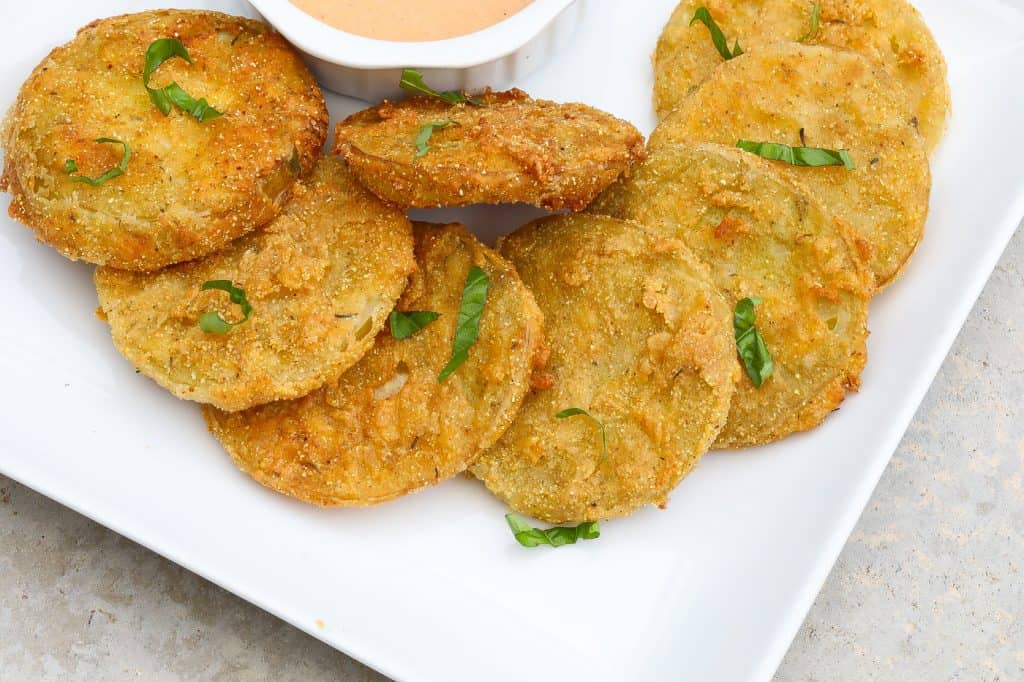 fried green tomatoes on a white plate