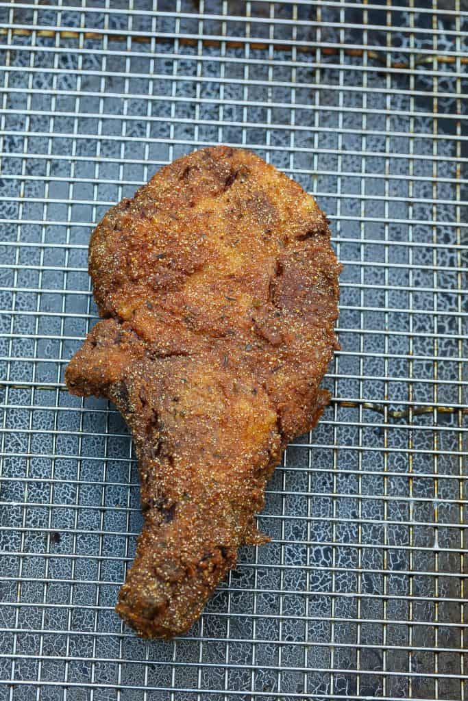 fried pork chop on wire rack