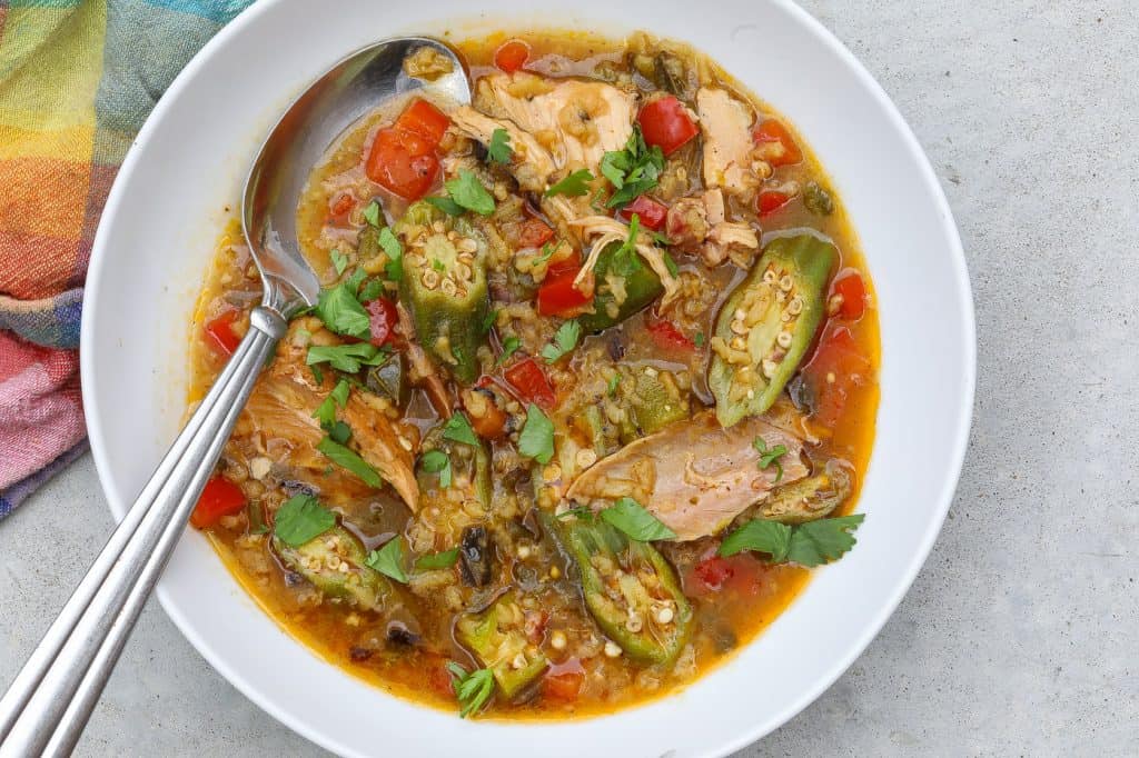 chicken and okra soup in a white bowl