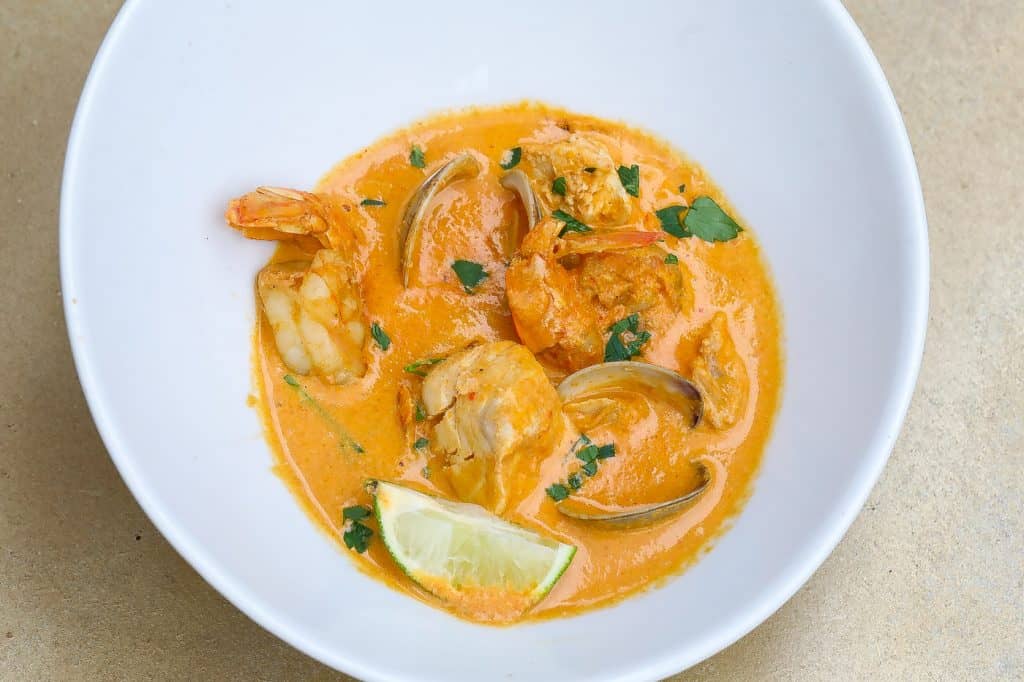 cazuela de mariscos (colombian seafood stew) in a white bowl