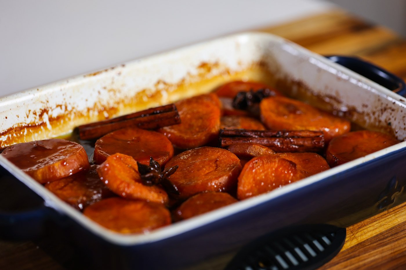 candied yams in a white baking dish