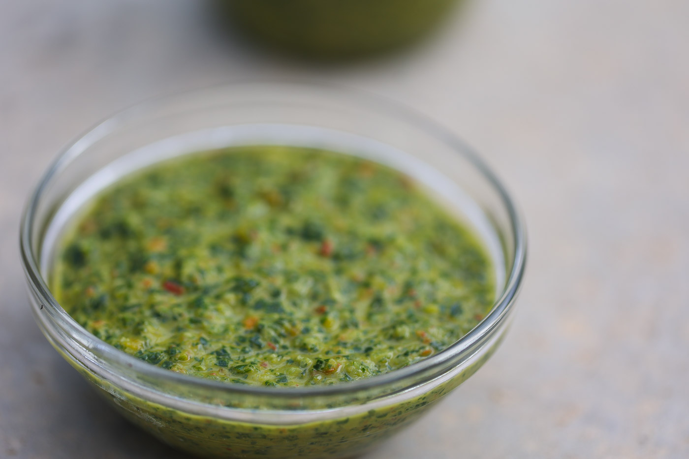 green seasoning base mix in a clear glass bowl