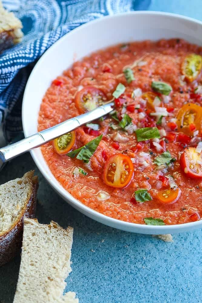 easy gazpacho recipe made with heirloom tomatoes, basil and red onions
