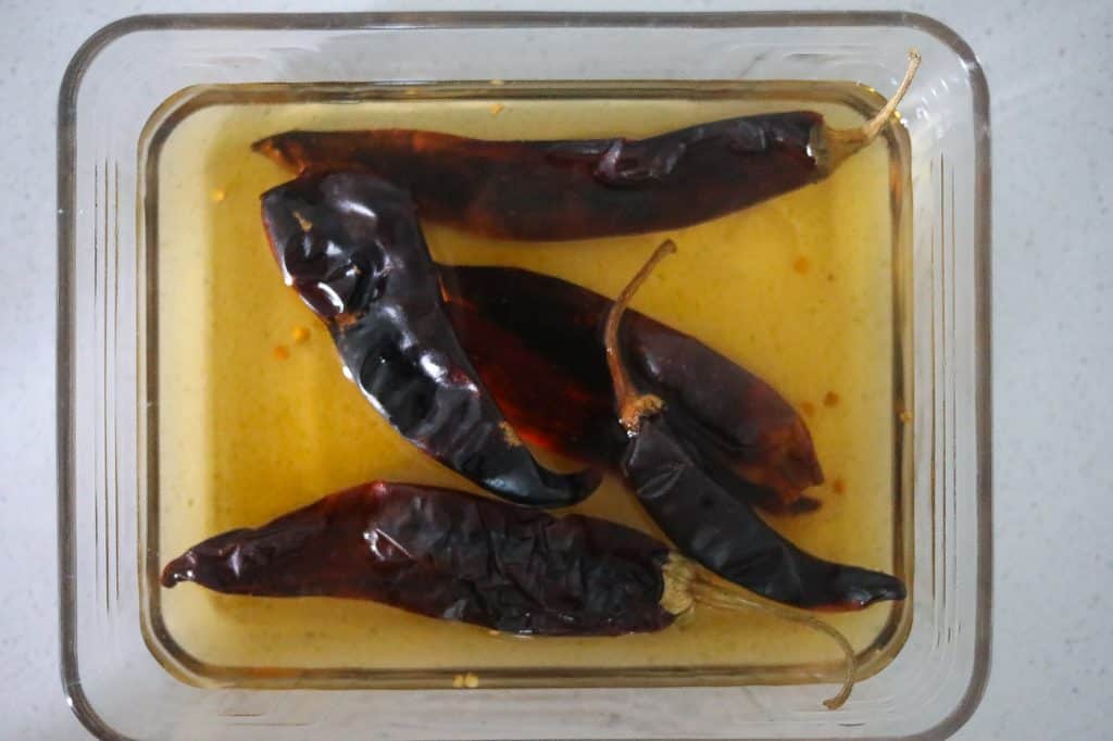 dried chilis in water