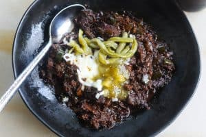 brisket chili in black bowl