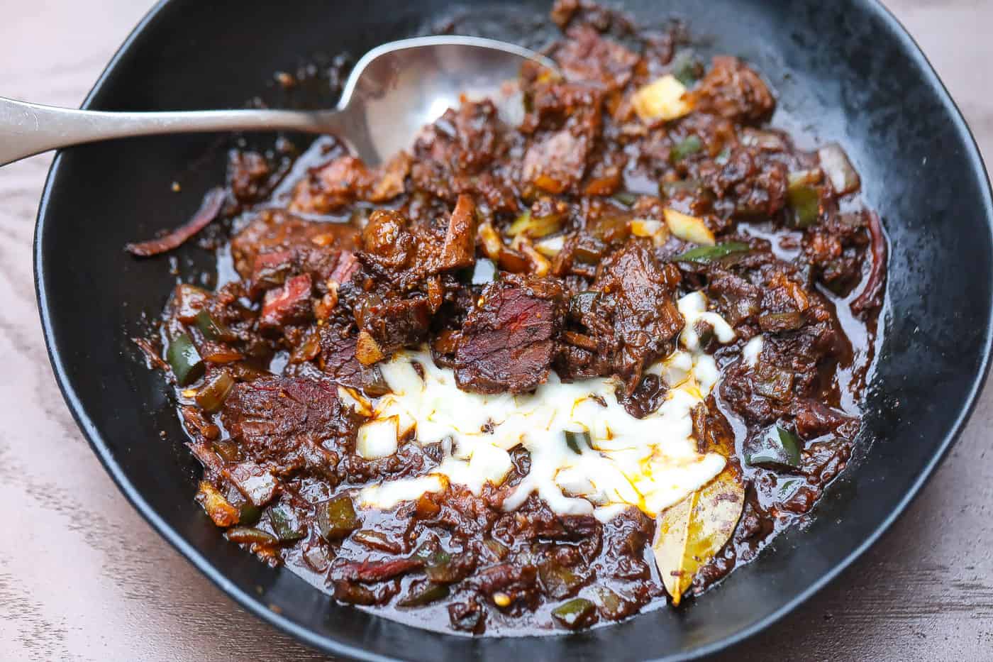 brisket chili in black bowl