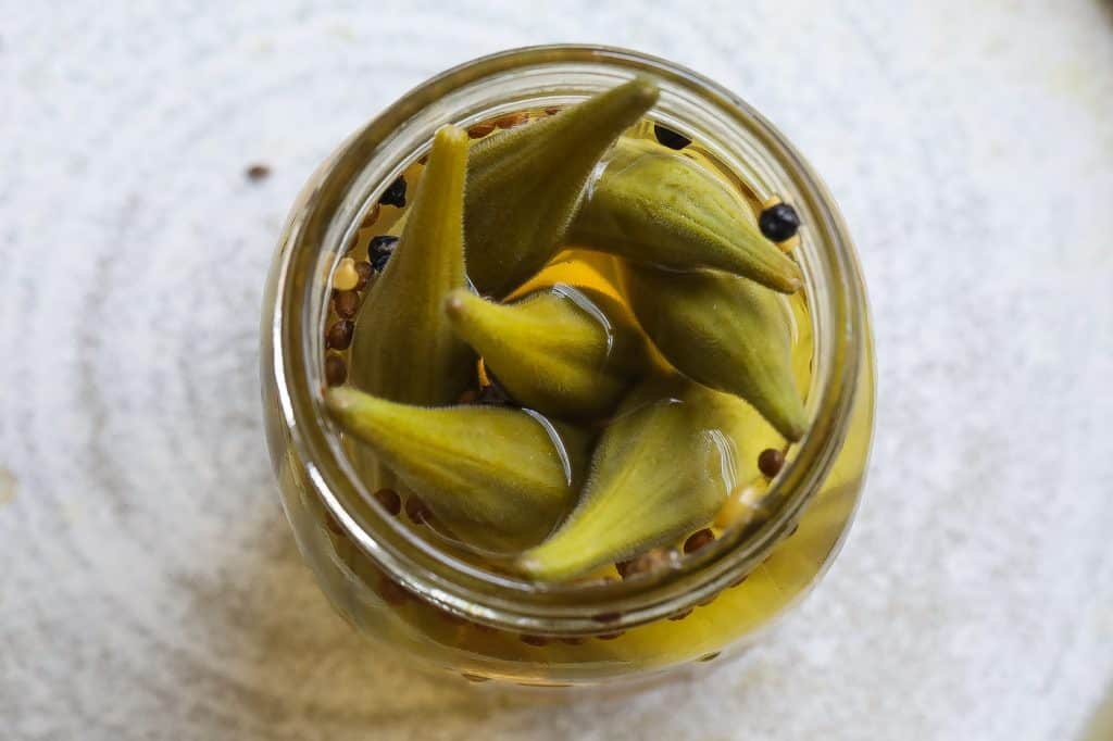 pickled okra in a glass jar