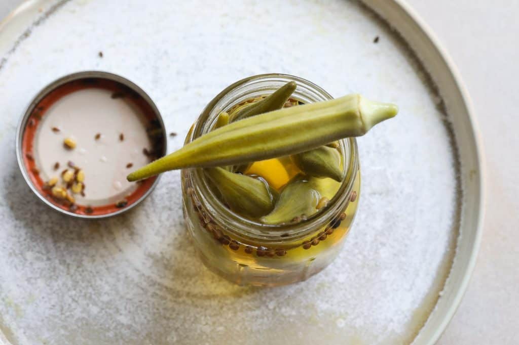 pickled okra in a glass jar