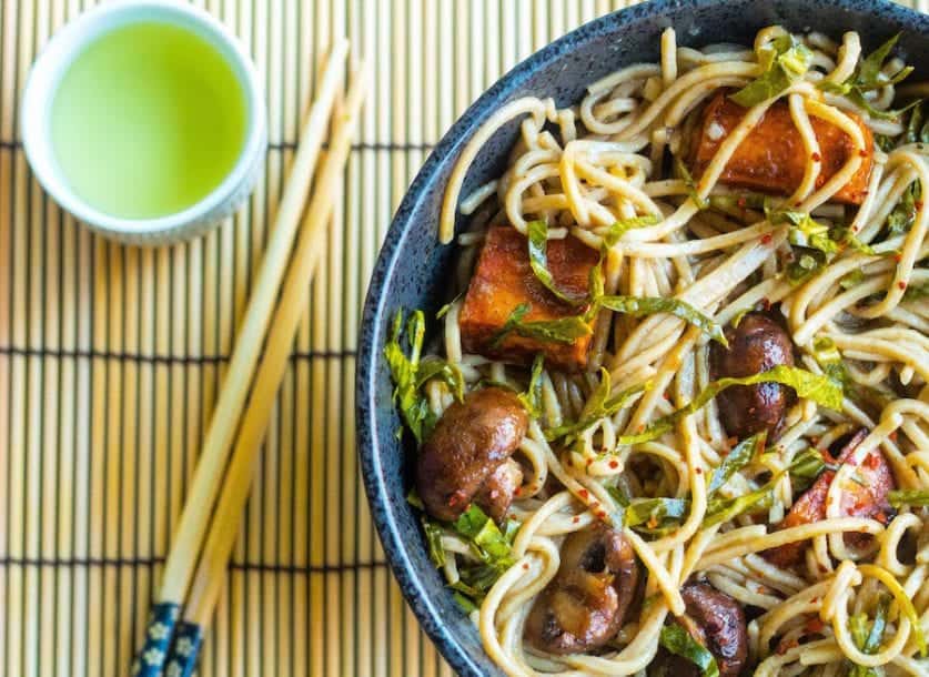 stir fried Soba Noodles bowl with roasted sweet potatoes, mushrooms, and collard greens.