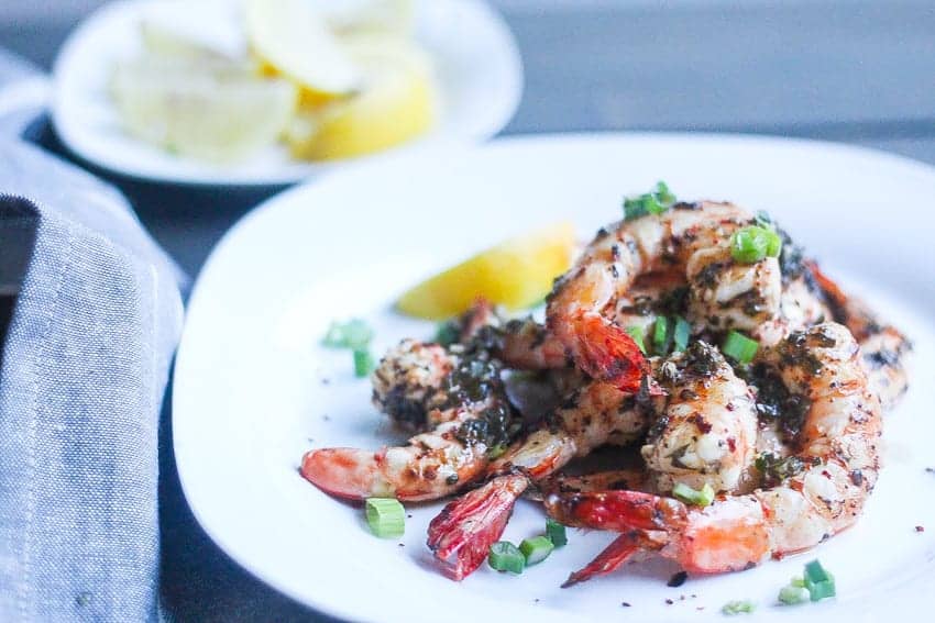 grilled piri piri shrimp on a plate with piri piri spices