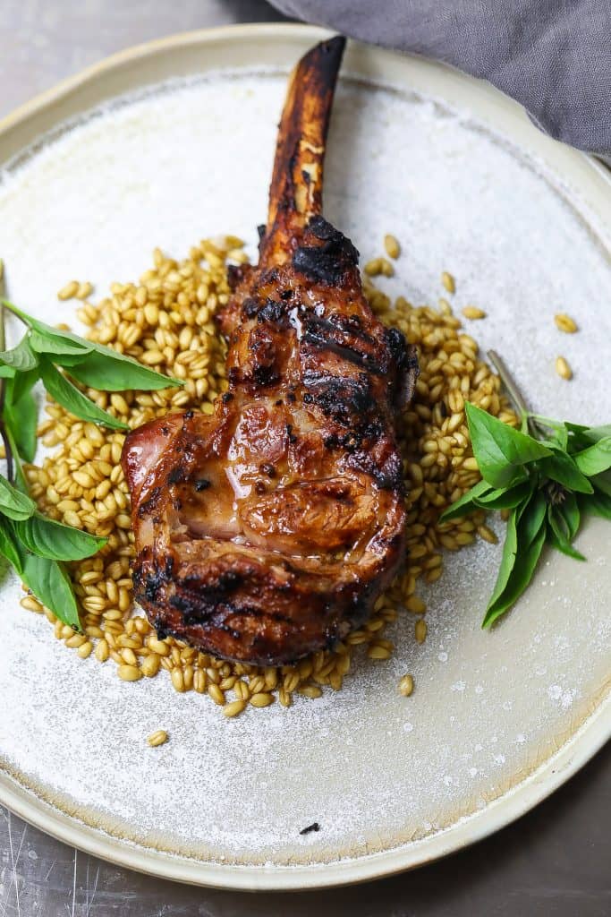grilled veal chop on bed of grains