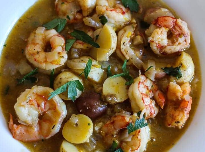 bowl of shrimp stew with potatoes and parsley #stew #shrimp www.foodfidelity.com
