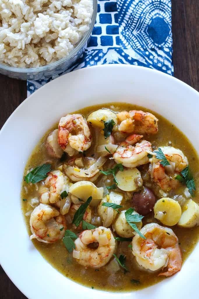 bowl of shrimp stew with potatoes and parsley #stew #shrimp www.foodfidelity.com