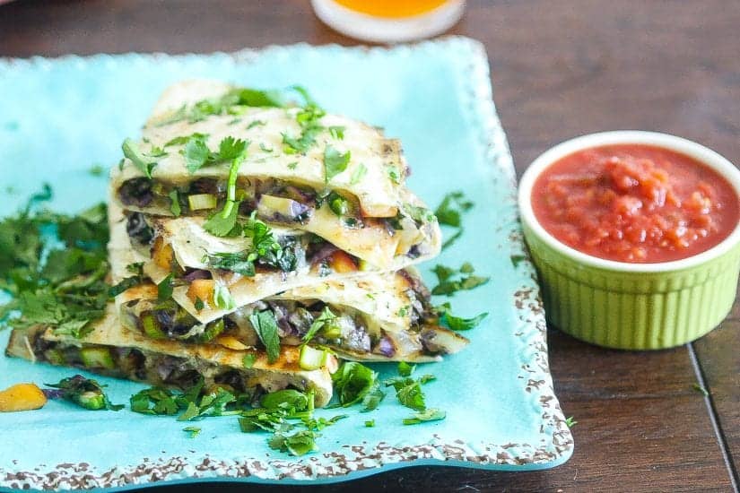 brussels sprouts quesadillas stacked on a plate #quesadillas #brusselssprouts www.foodfidelity.com
