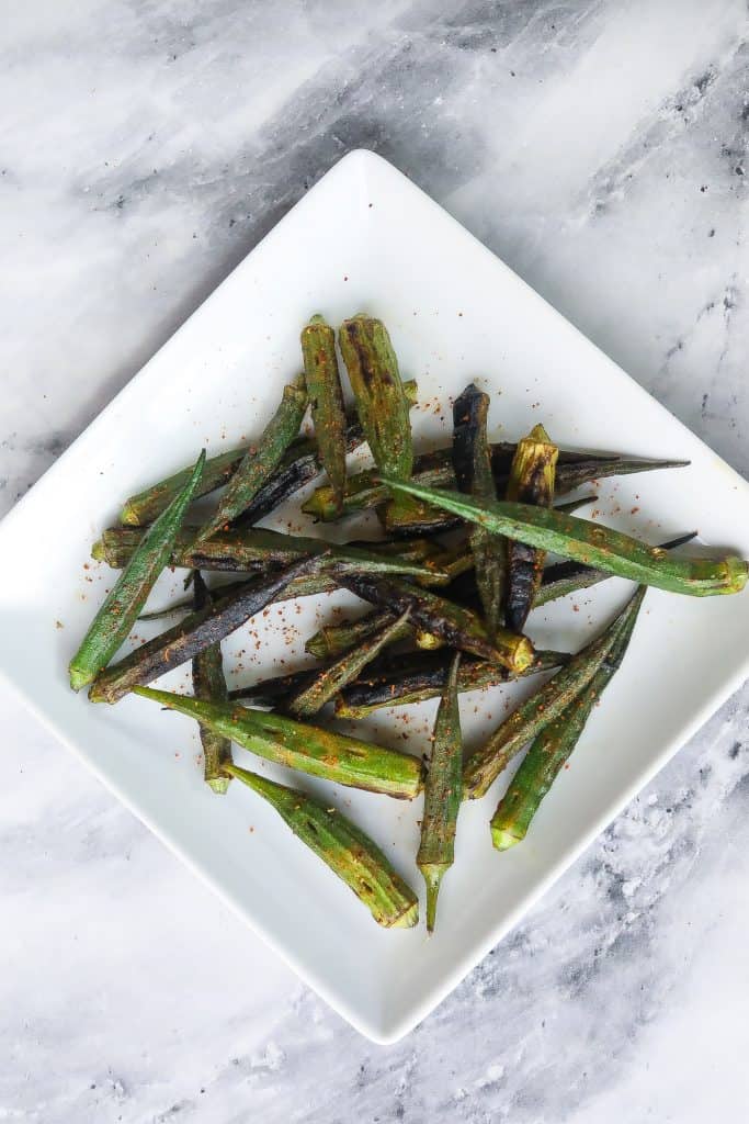 grilled okra on a white plate