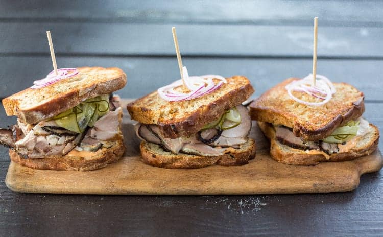 trio of sandwiches on a cutting board