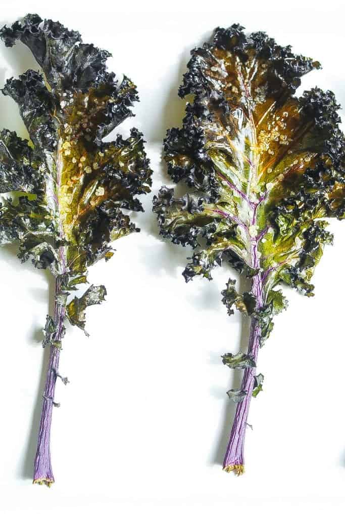 baked kale chips on a baking sheet #kalechips www.foodfidelity.com