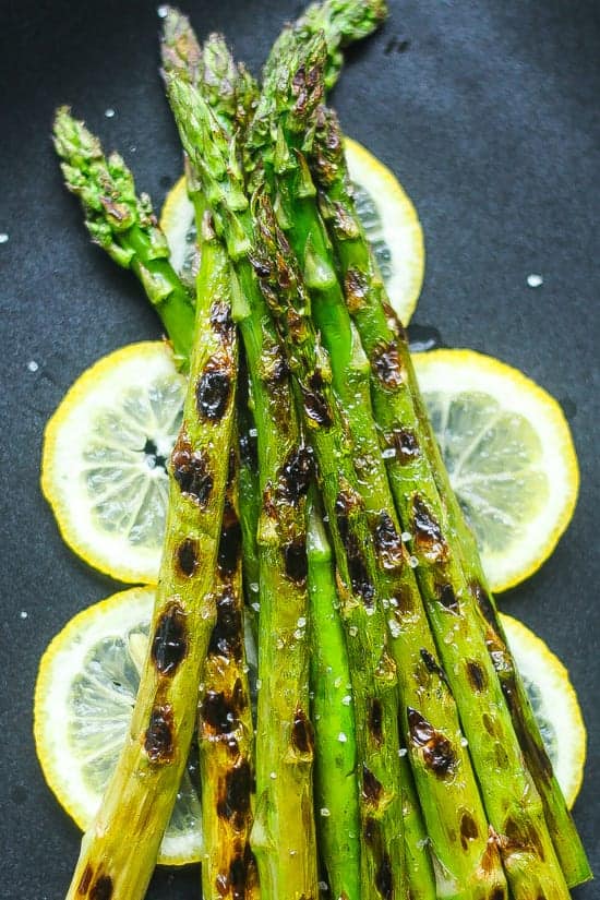 Grilled asparagus on a bed of lemon slices