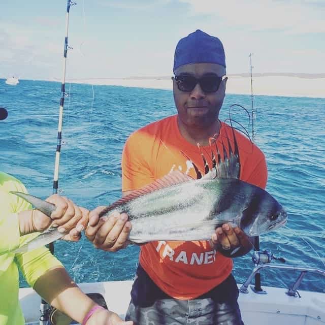 guy holding large mahi mahi fish